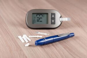 closeup-blood-lancet-device-used-blood-testing-blood-glucose-meter-diabetics-background-scaled-e1637943028955
