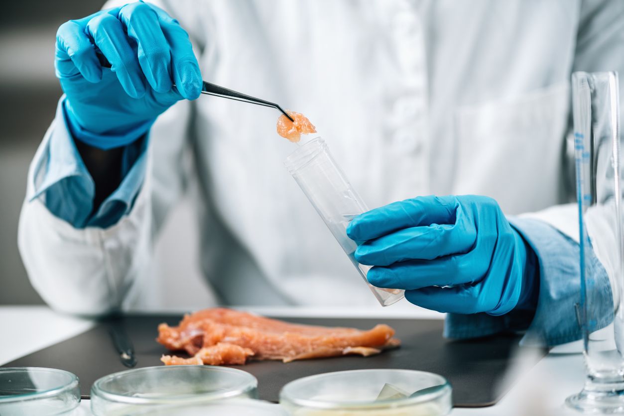 A food safety professional tests a food sample to measure against their HACCP Critical Limits.
