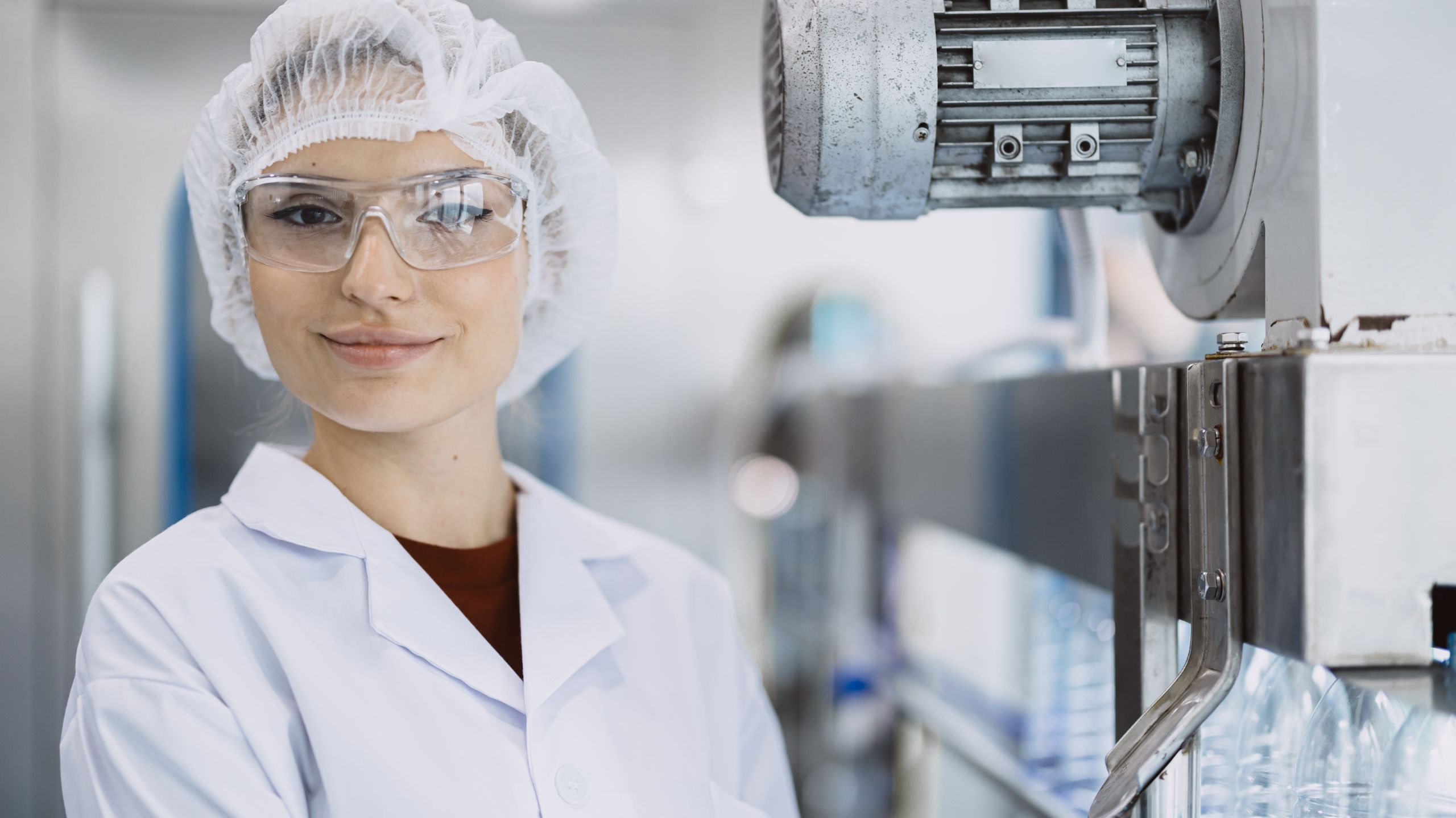 A young food industry professional smiles knowing her Food Facility Registration Renewal was submitted accurately and on time.