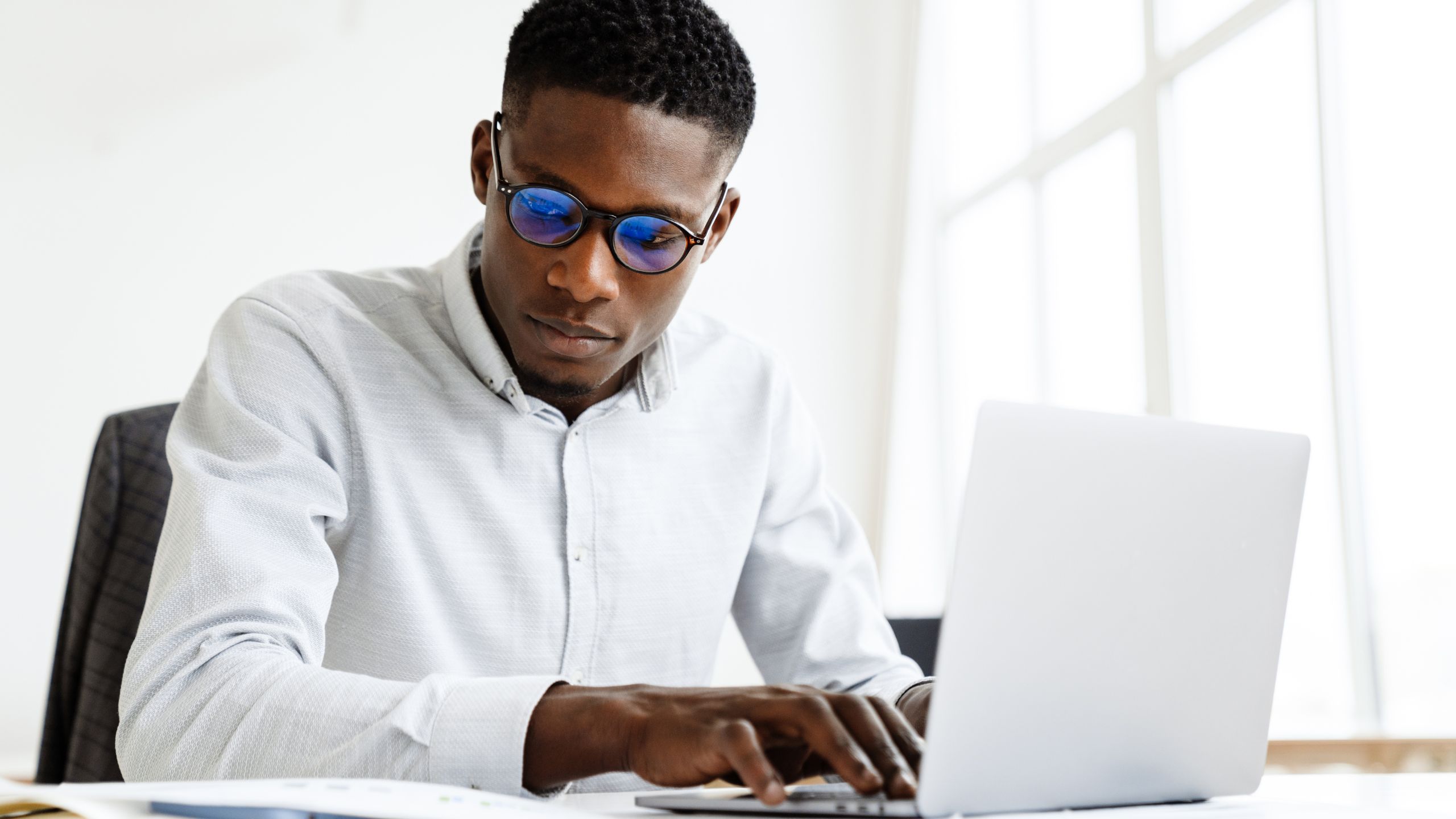 A PCQI sits at his desk as he works through preventive controls validation.