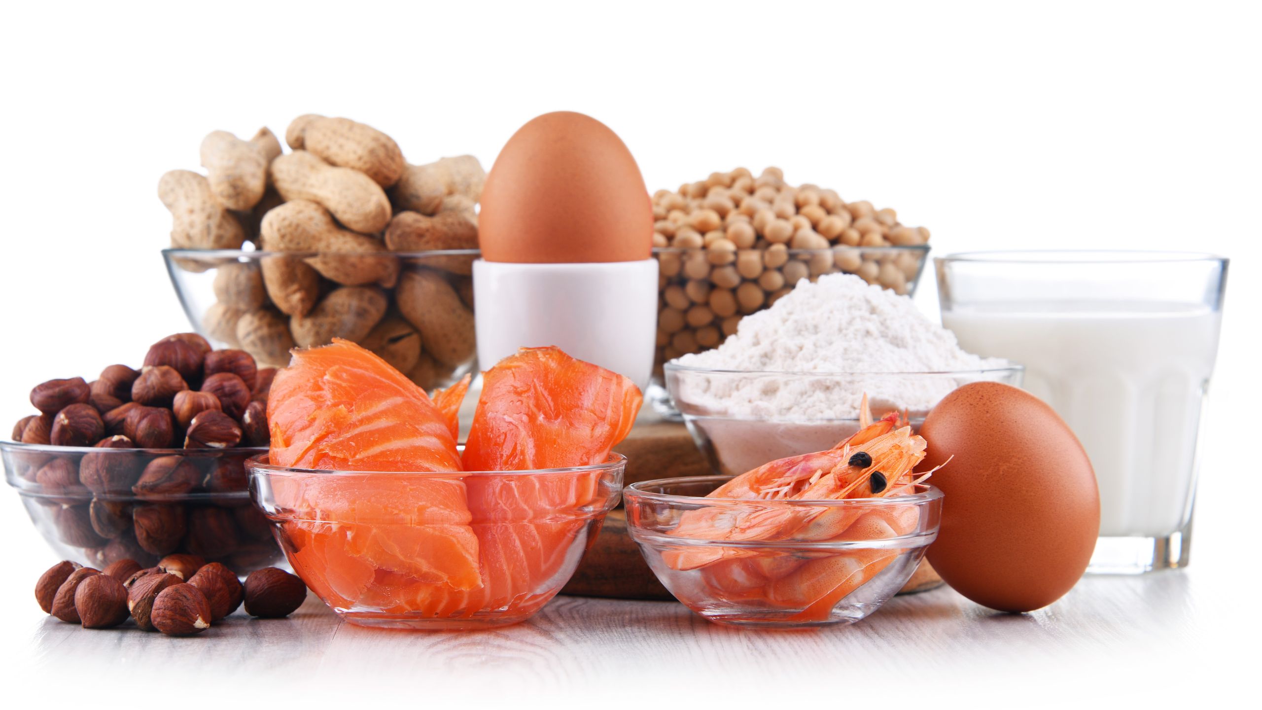 Various food allergens A PCQI must be aware of, for both FSMA & SQF, are grouped together in glass bowls