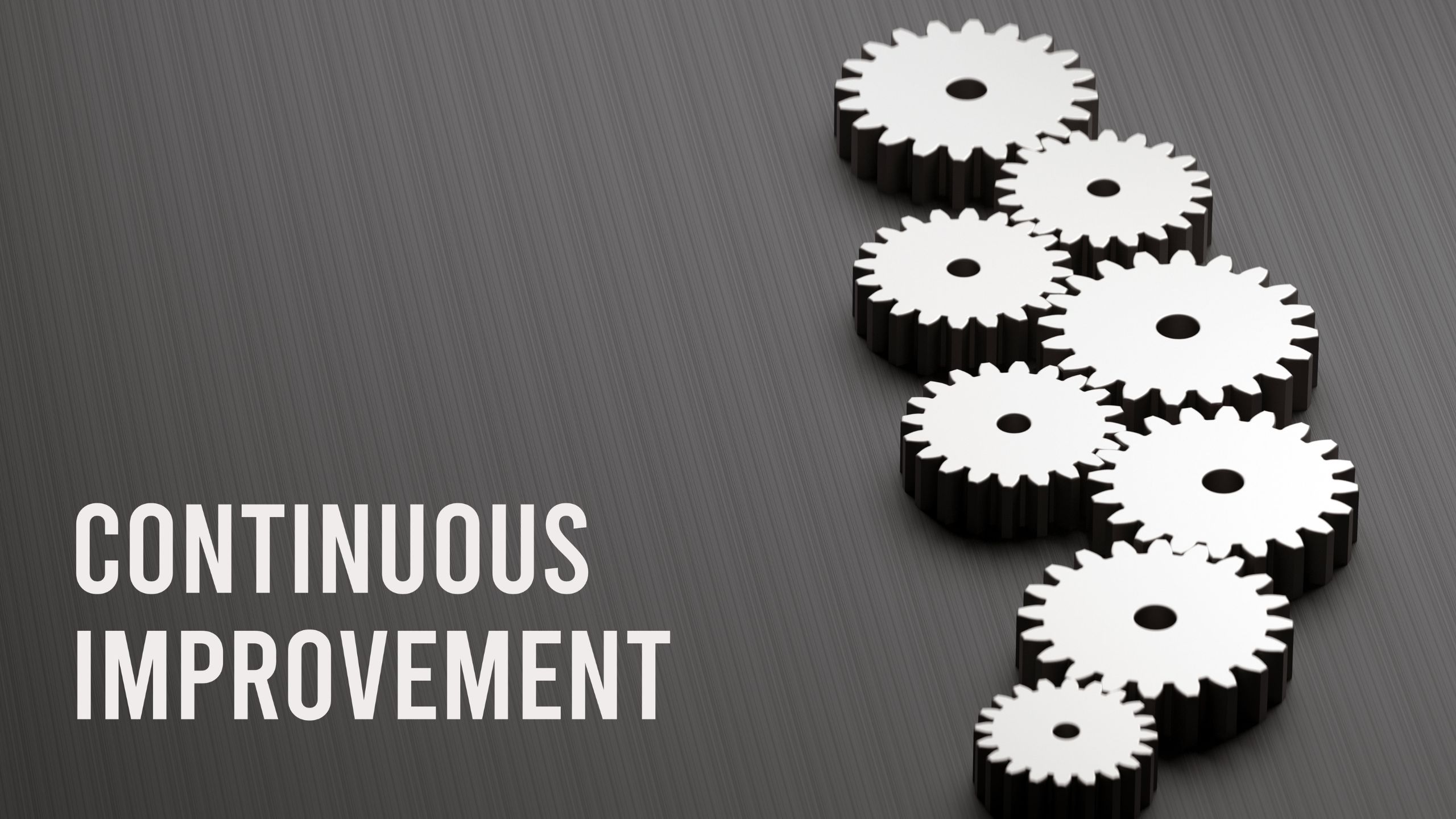 Several gears are placed together representing the cross-functional process that drives continuous improvement in the SQF Quality Code.